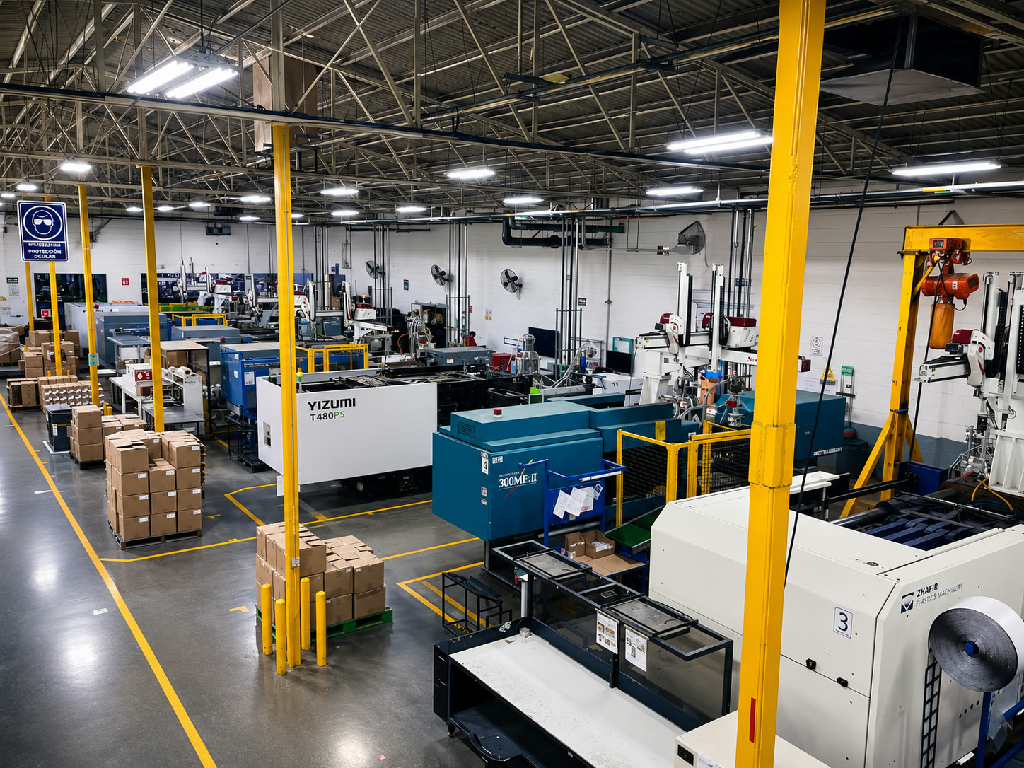 AZMEX manufacturing floor with rows of injection molding machines